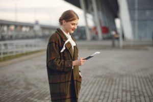 young woman with traveling documents